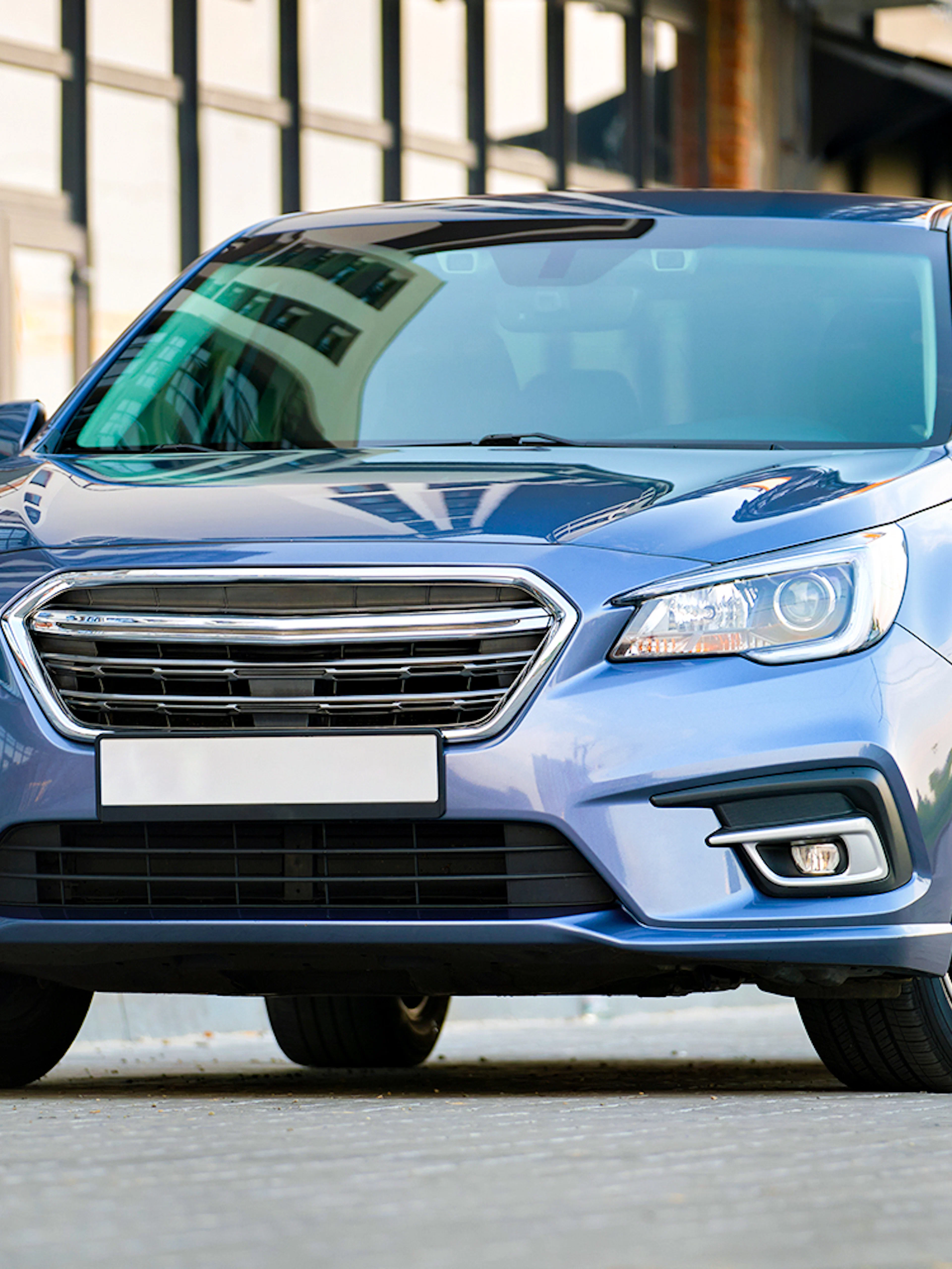 Business sedan parked for private airport transfer service.