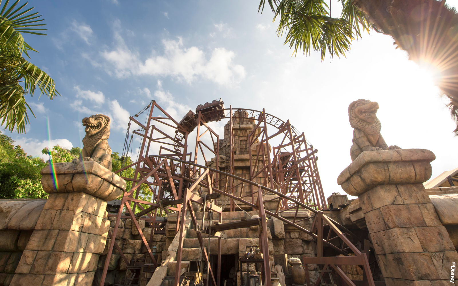 Indiana Jones roller coaster at Disneyland Paris with temple ruins in the background.