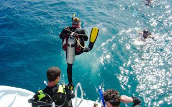 Scuba divers jumping into the Red Sea for a dive, Hurghada.