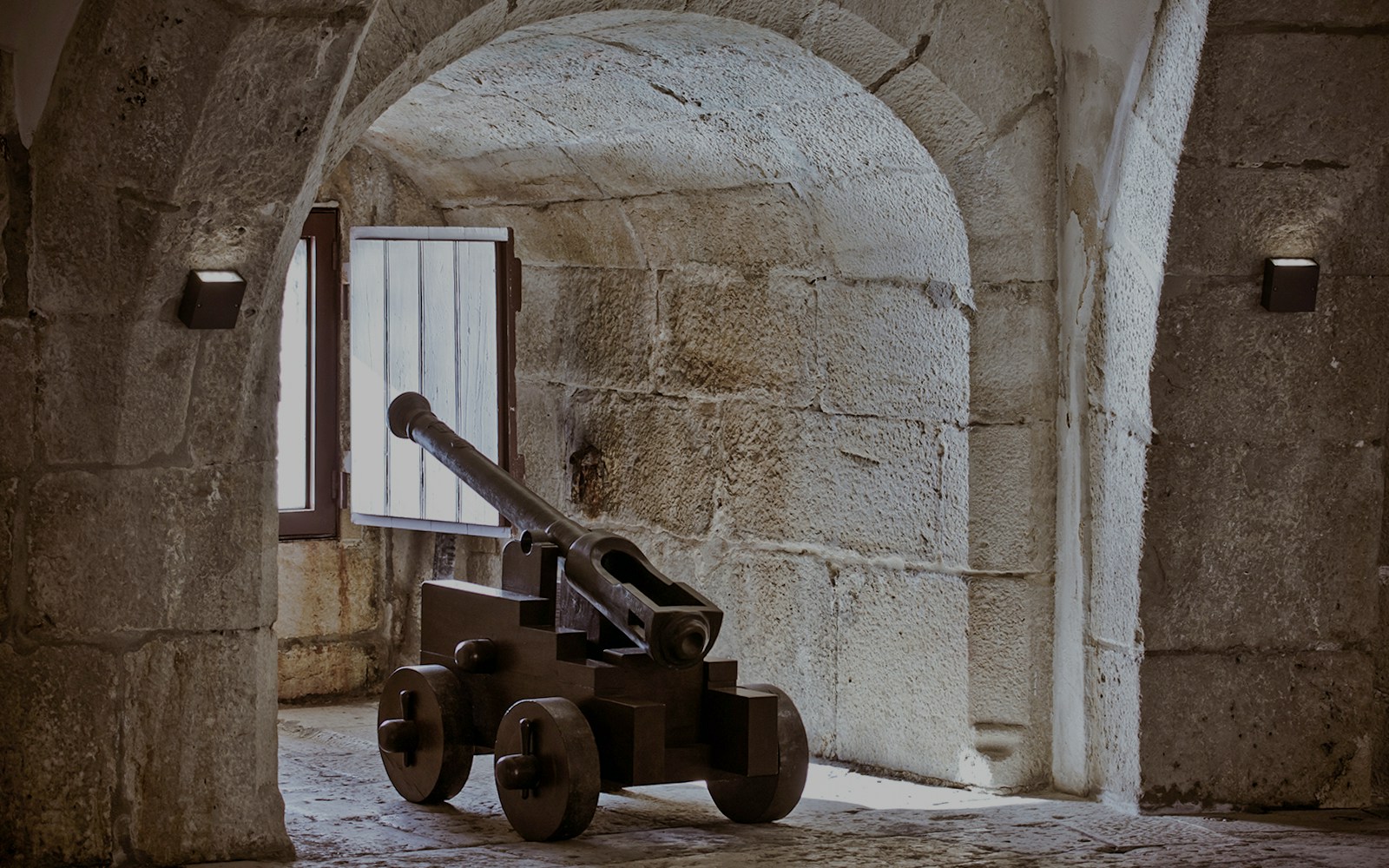 Cannon inside the stone vault of Belem Tower, Lisbon.