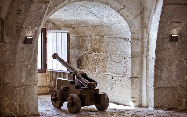 Cannon inside the stone vault of Belem Tower, Lisbon.
