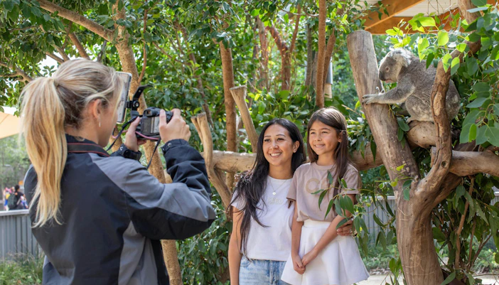 Kids at the zoo taking pictures