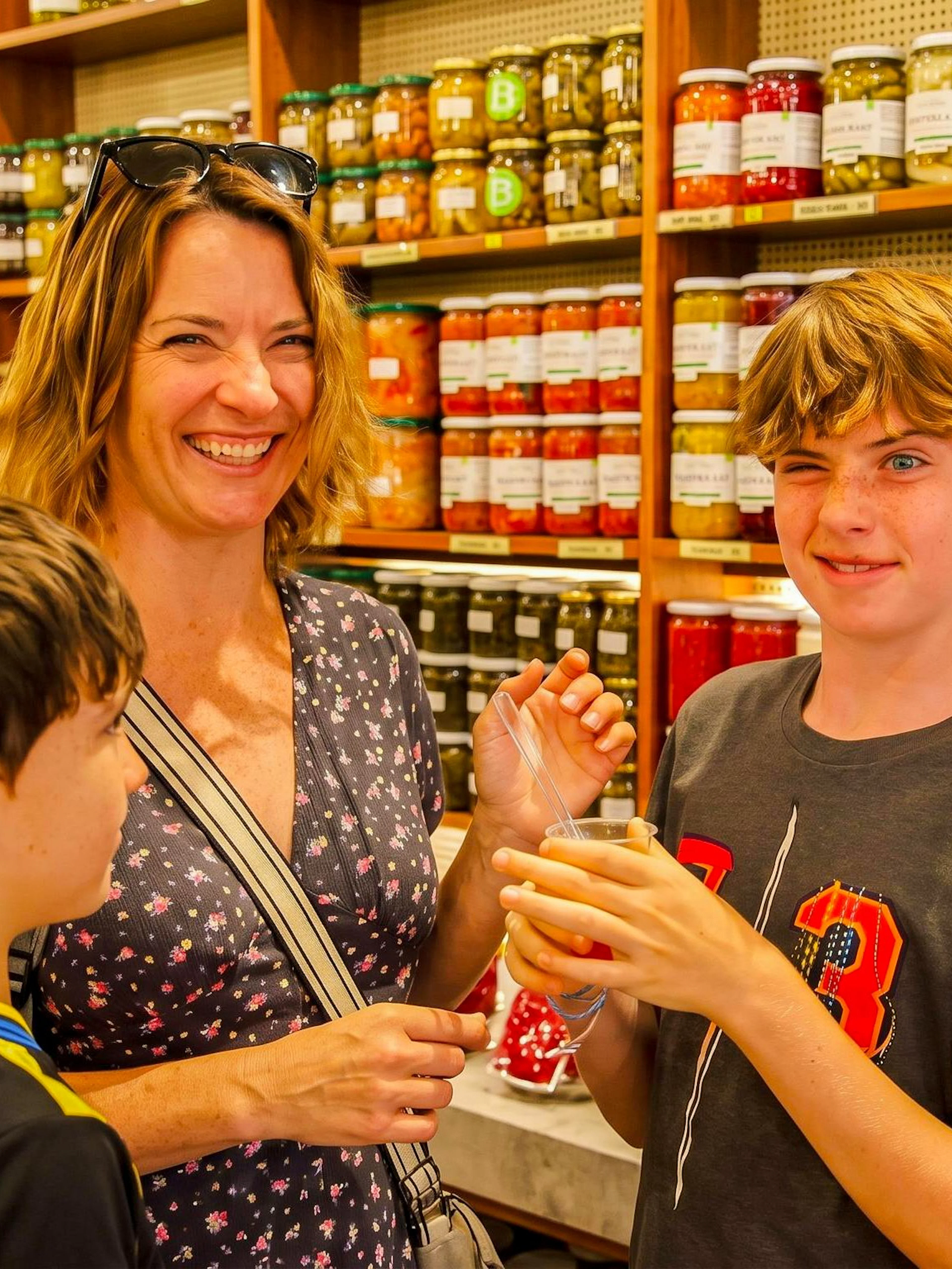 Family enjoying pickles at a shop during an Istanbul food tour.