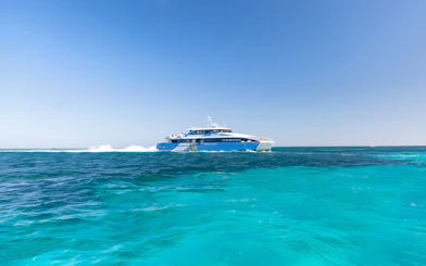 Ferry cruising on turquoise waters towards Rottnest Island from Perth.