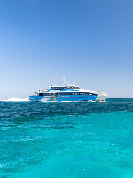 Ferry cruising on turquoise waters towards Rottnest Island from Perth.