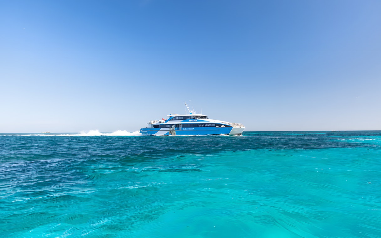 Ferry cruising on turquoise waters towards Rottnest Island from Perth.