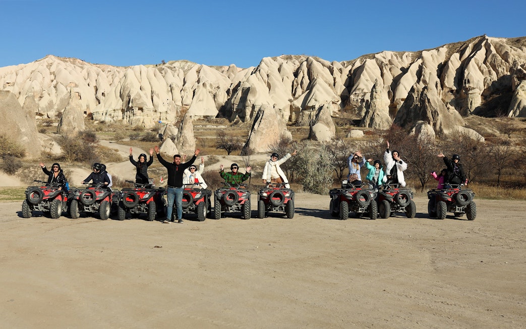 Group on ATVs exploring Cappadocia's unique rock formations.