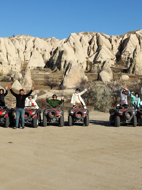 Group on ATVs exploring Cappadocia's unique rock formations.