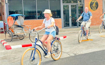 Cyclists exploring Bangkok's Green Lung area on a guided bike tour.