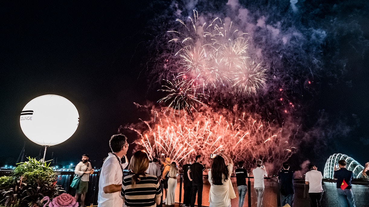People enjoying a view of fireworks from Twenty3, Singapore F1