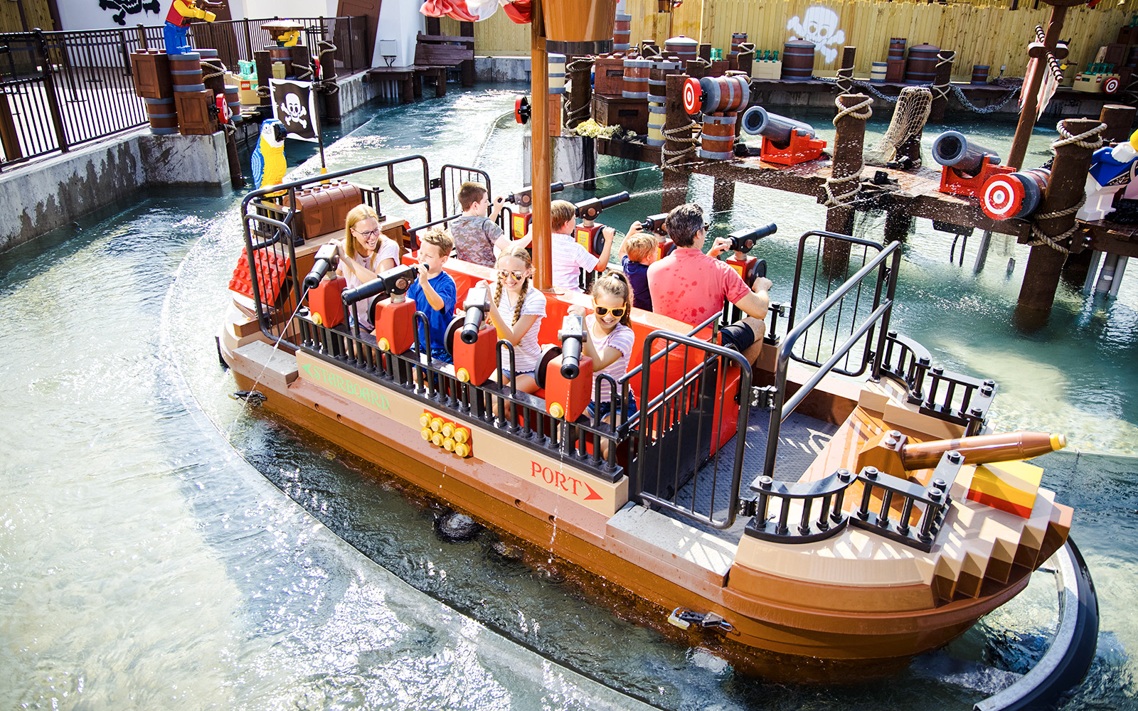 Guests enjoying a pirate-themed boat ride at Legoland New York.
