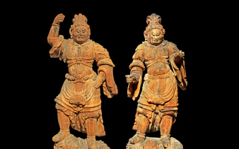 Two wooden warrior statues at Asian Civilisations Museum, Singapore.