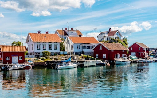 Harbor view with colorful houses and boats in Gothenburg, Sweden.