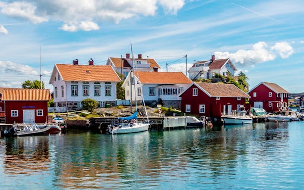 Harbor view with colorful houses and boats in Gothenburg, Sweden.