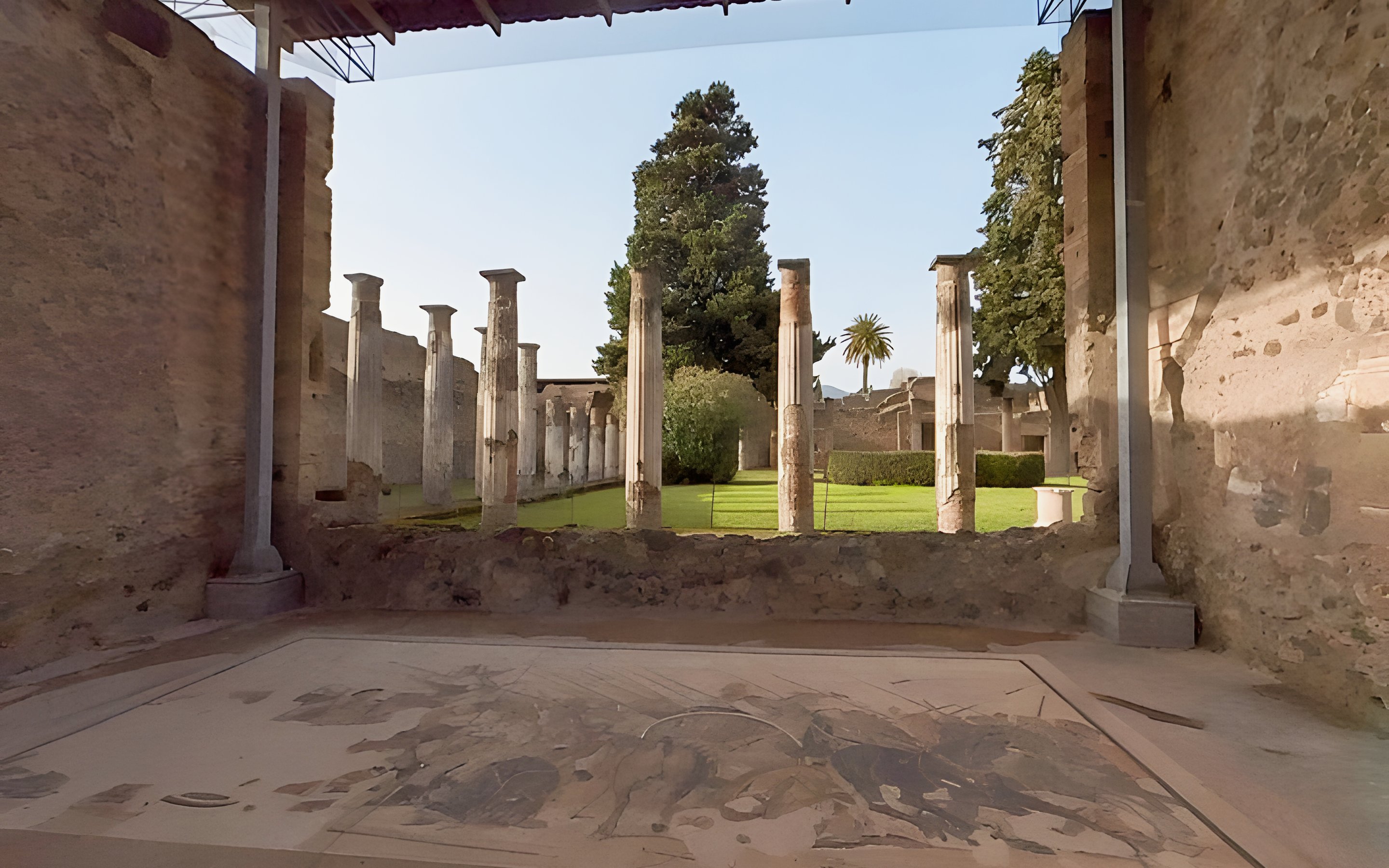 Ancient columns and garden at the archaeological site of Pompeii, Italy.