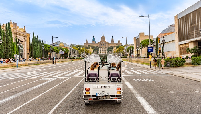 Woman on Barcelona explroing tuk tuk ride