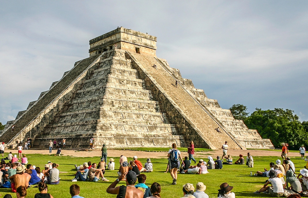People climbing Pyramid of Kukulcan at Chichen Itza, southern Mexico.