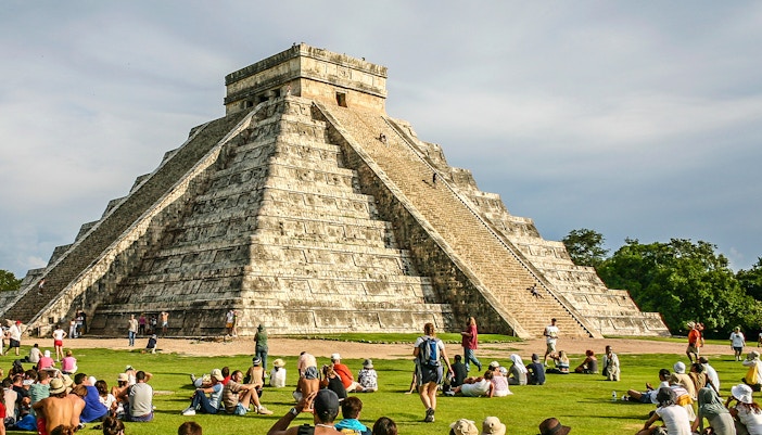 People climbing Pyramid of Kukulcan at Chichen Itza, southern Mexico.