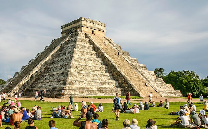 People climbing Pyramid of Kukulcan at Chichen Itza, southern Mexico.
