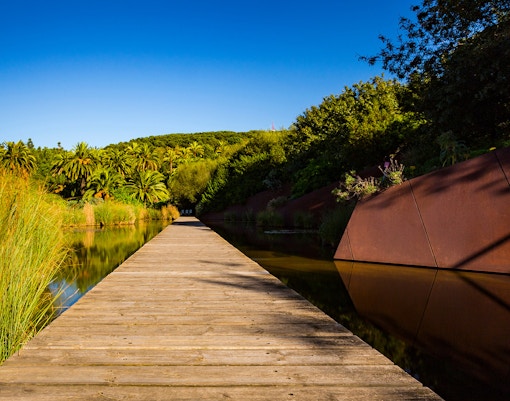 Tourists exploring a museum in Barcelona with the All Inclusive Card, offering access to over 25 museums and transportation services