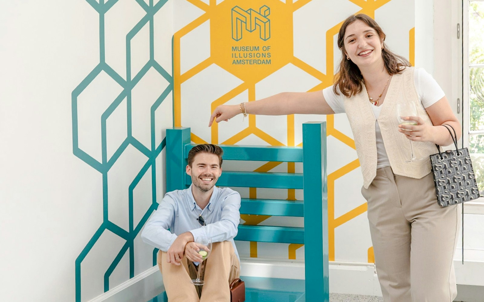 Guests enjoying an optical illusion at the Museum of Illusions Amsterdam.