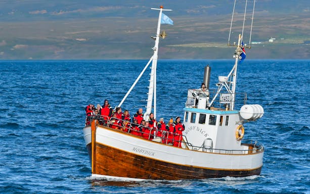 Whale watching tourists on the Moby Dick boat in Icelandic waters.