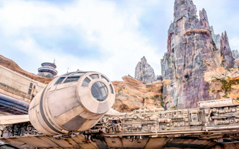 Spaceship attraction at Universal Studios Resort, Orlando, Florida with rocky landscape.