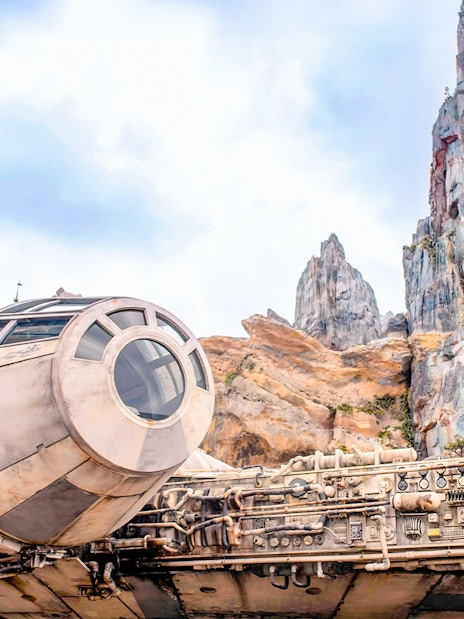 Spaceship attraction at Universal Studios Resort, Orlando, Florida with rocky landscape.
