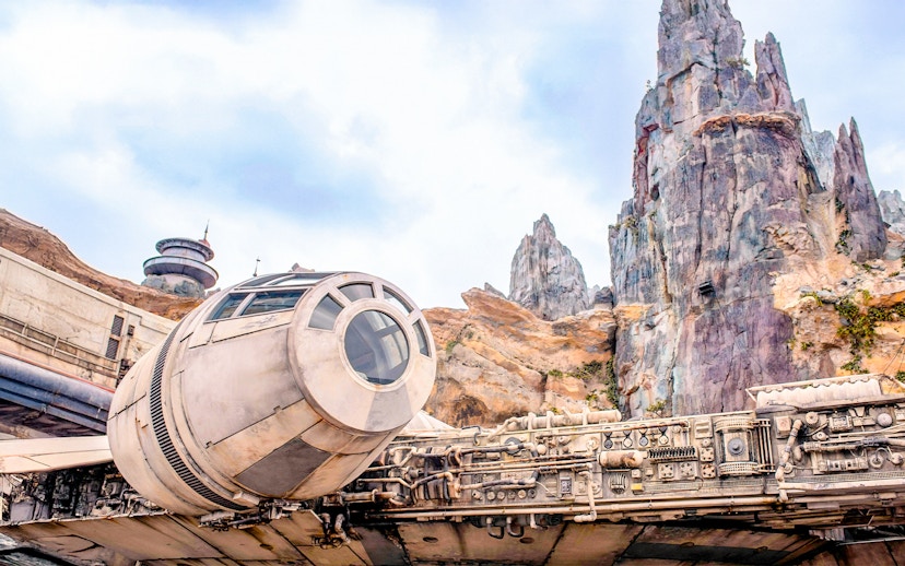 Spaceship attraction at Universal Studios Resort, Orlando, Florida with rocky landscape.