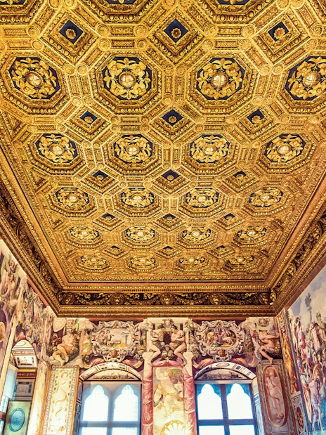 Palazzo Vecchio ornate ceiling and frescoes during skip-the-line guided tour in Florence, Italy.