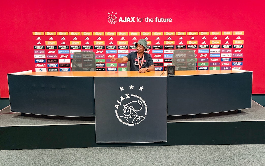 Press room at Johan Cruijff ArenA with Ajax branding, part of the Classic Tour experience.