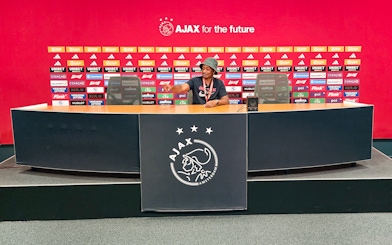Press room at Johan Cruijff ArenA with Ajax branding, part of the Classic Tour experience.