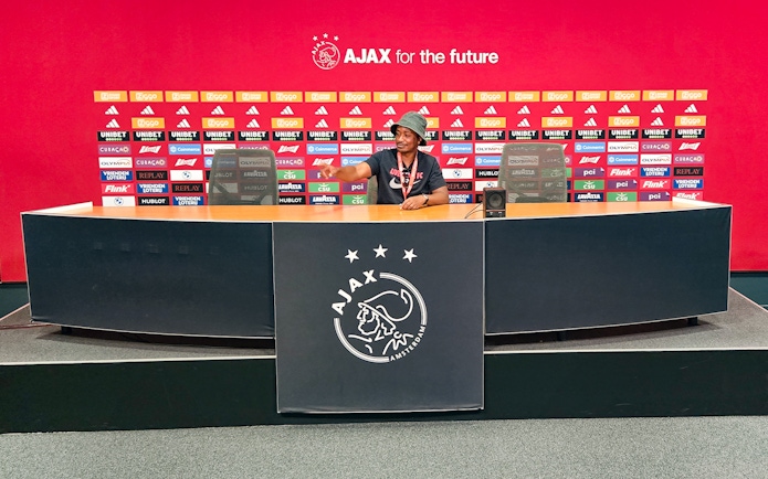 Press room at Johan Cruijff ArenA with Ajax branding, part of the Classic Tour experience.