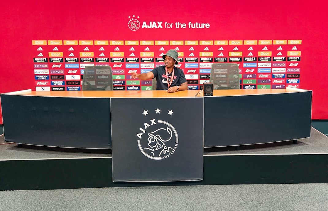 Press room at Johan Cruijff ArenA with Ajax branding, part of the Classic Tour experience.