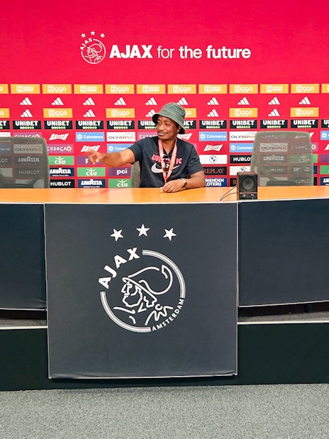 Press room at Johan Cruijff ArenA with Ajax branding, part of the Classic Tour experience.