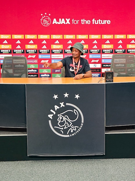 Press room at Johan Cruijff ArenA with Ajax branding, part of the Classic Tour experience.