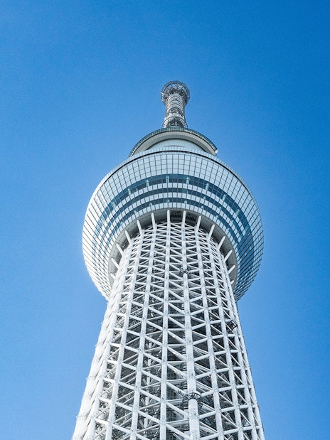 Tokyo Skytree tower against a clear blue sky.