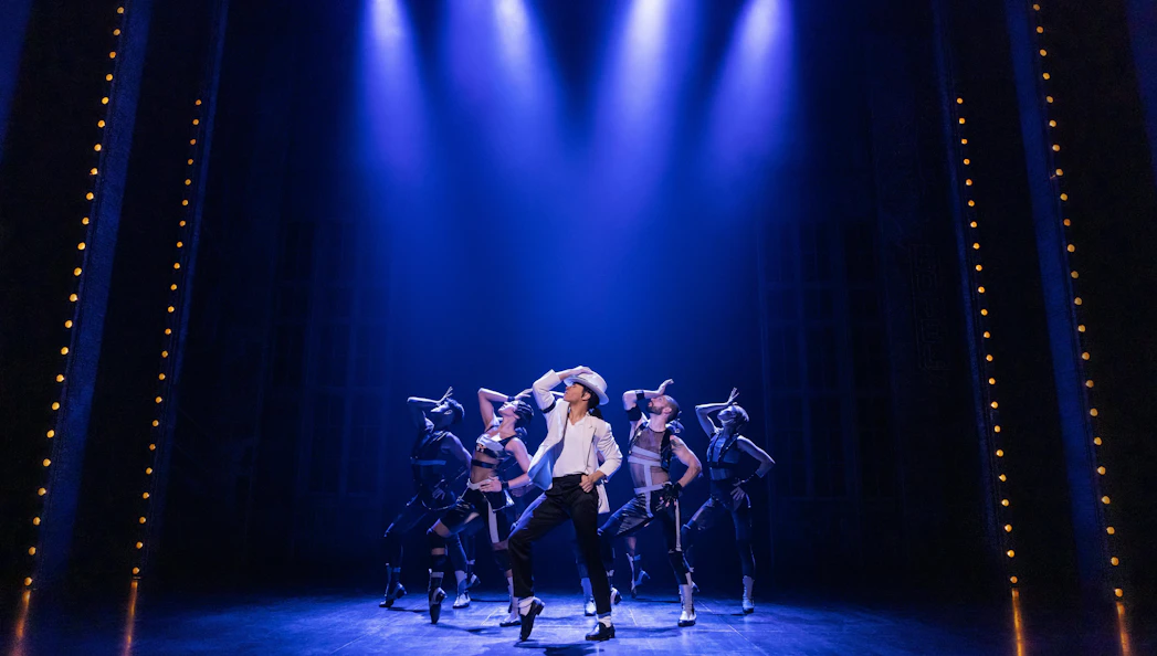 Performers dancing on stage during MJ the Musical on Broadway.