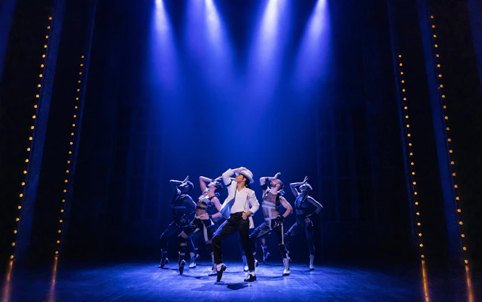 Performers dancing on stage during MJ the Musical on Broadway.