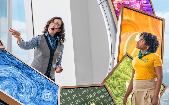 Guide explaining exhibits at One World Observatory VIP Tour, New York City.