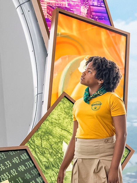 Guide explaining exhibits at One World Observatory VIP Tour, New York City.