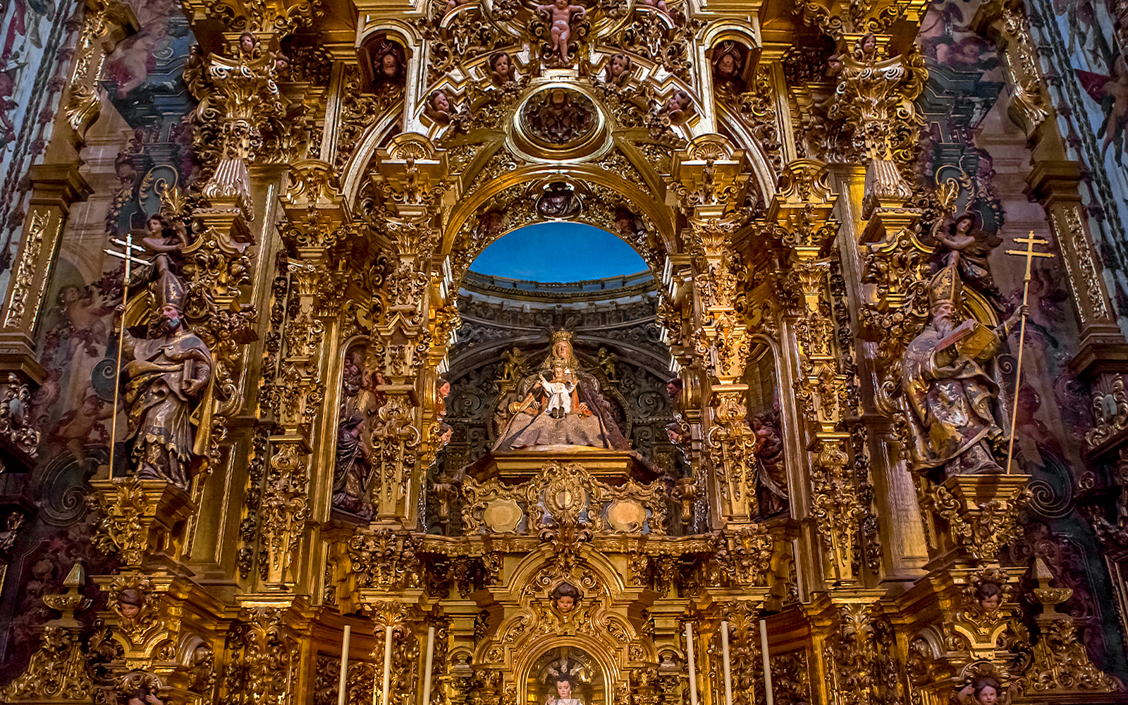 Elaborate gold altar details in El Salvador church, Seville, Andalusia, Spain.