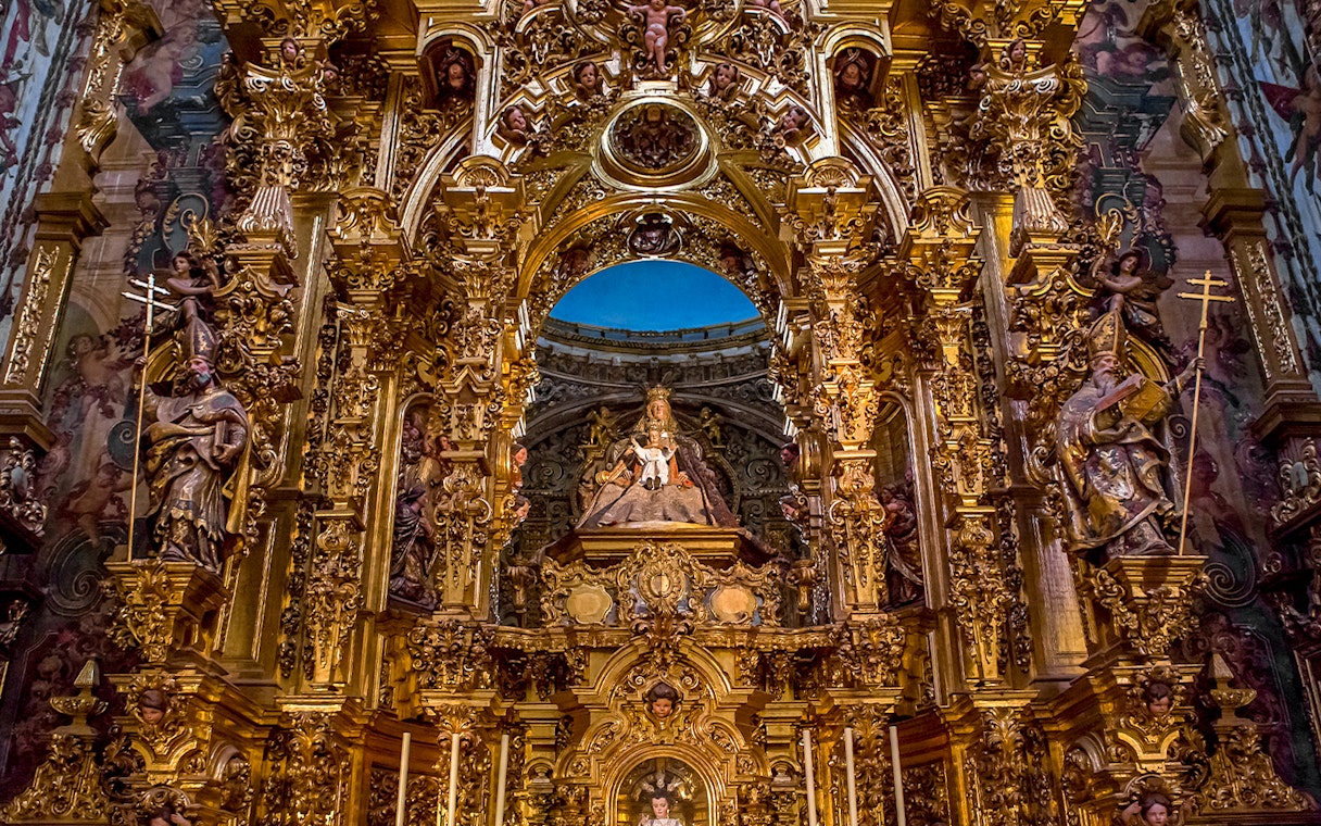 Elaborate gold altar details in El Salvador church, Seville, Andalusia, Spain.