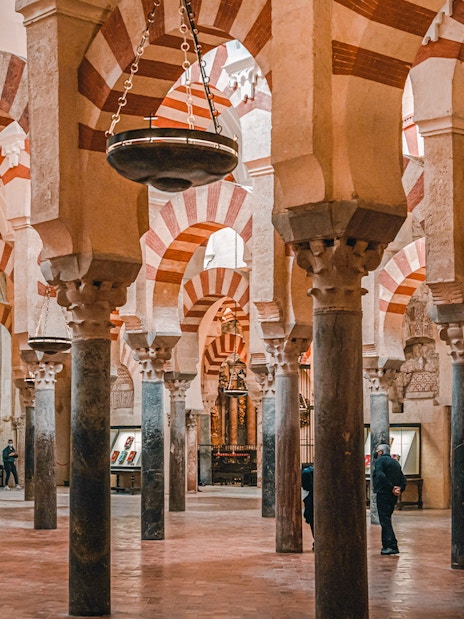 Interior arches of Cordoba Mosque-Cathedral during guided tour.
