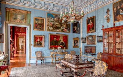 Room with ornate chandelier and paintings in Liria Palace, Madrid.