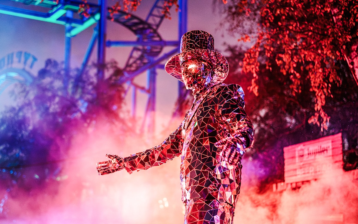 Performer in reflective costume at Halloween event, Bobbejaanland, Belgium.