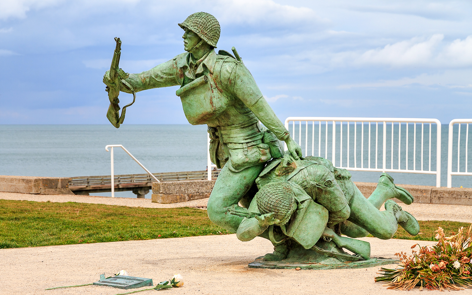 116th Regimental Combat Team Memorial statue in Normandy, France, near the sea.