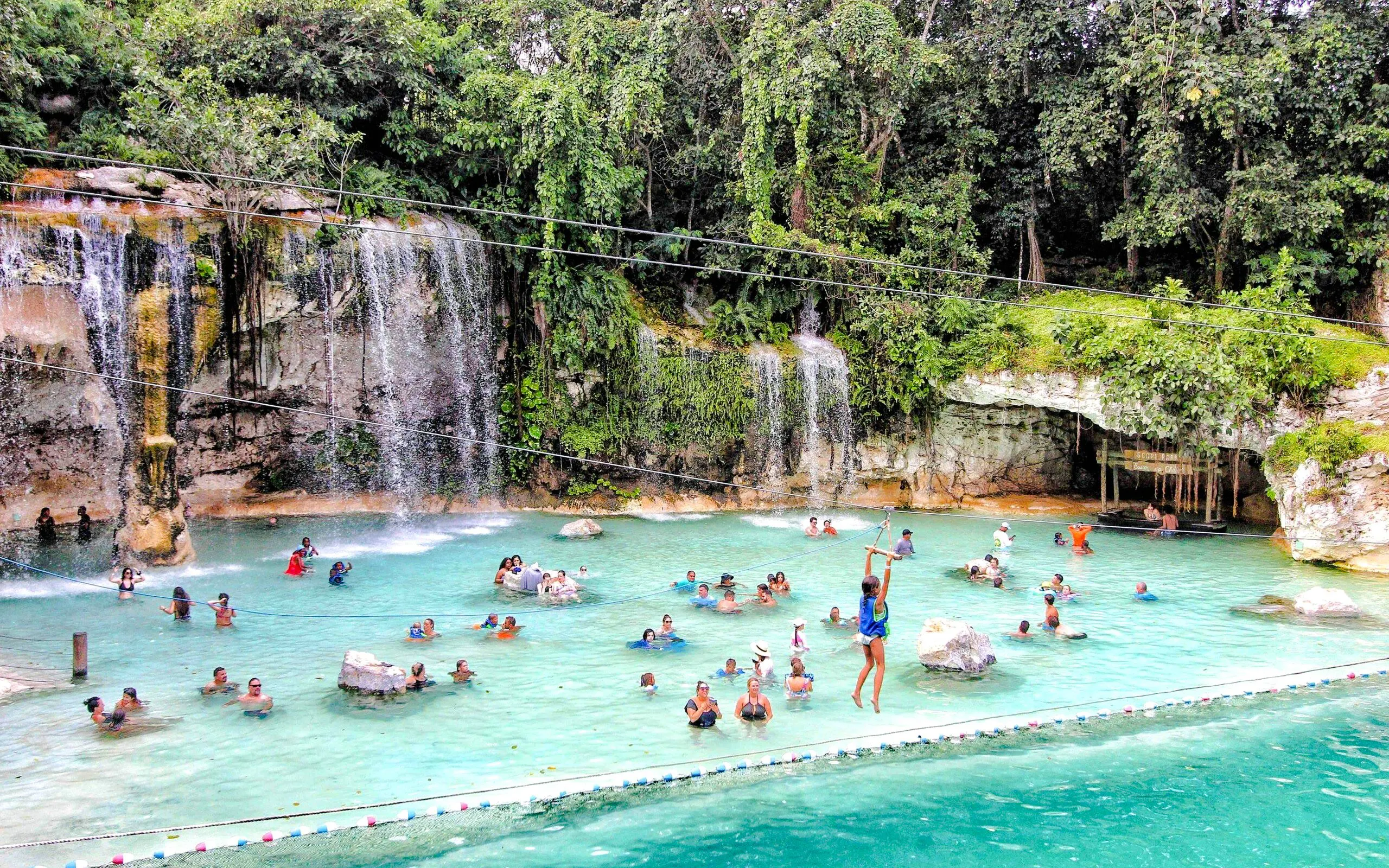 Visitors enjoying the Saltos Azules water attraction at Scape Park, Cap Cana, Dominican Republic.
