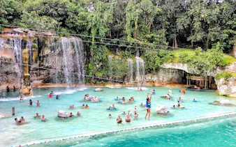 Visitors enjoying the Saltos Azules water attraction at Scape Park, Cap Cana, Dominican Republic.