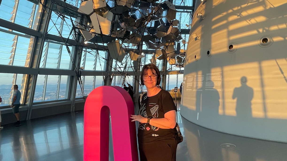Tourist inside Glories Skyline Tower with modern architecture and city view.